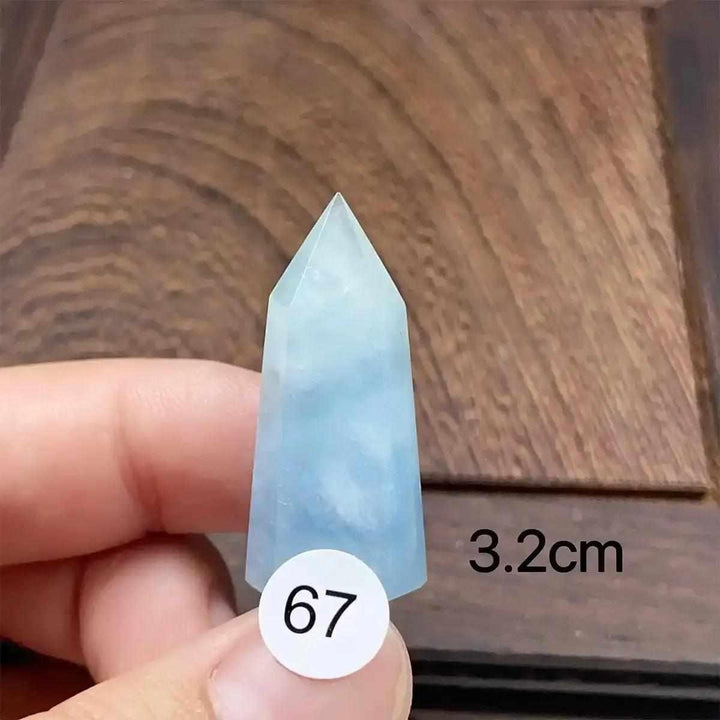 Small Aquamarine Mini Tower crystal with a faceted point, featuring calming sea-blue hues for meditation and healing.