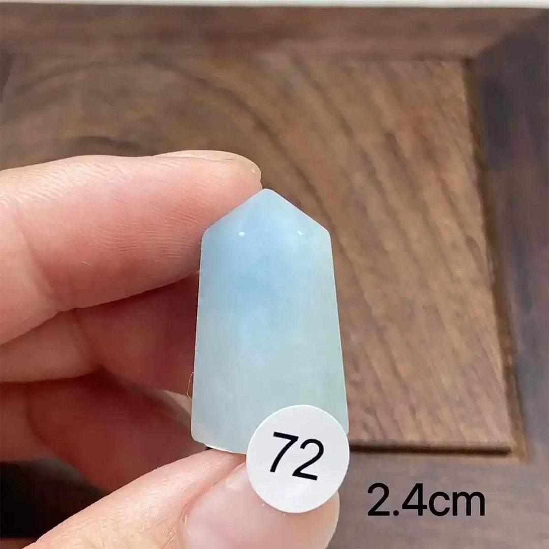 Small Aquamarine Mini Tower with a faceted point, featuring calming sea-blue tones for Throat and Heart chakra healing.