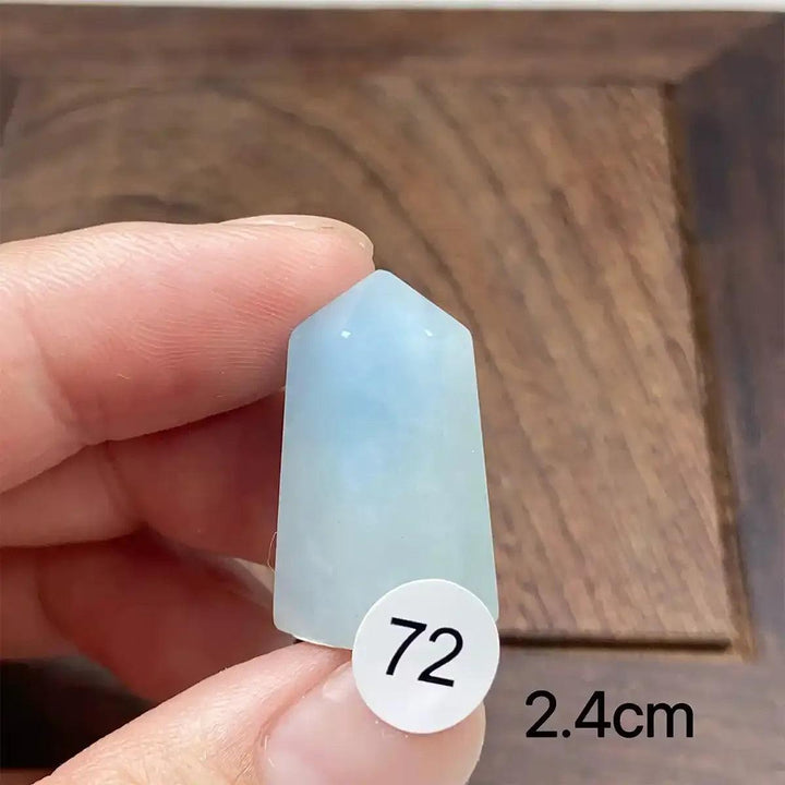 Small Aquamarine Mini Tower with a faceted point, featuring calming sea-blue tones for Throat and Heart chakra healing.