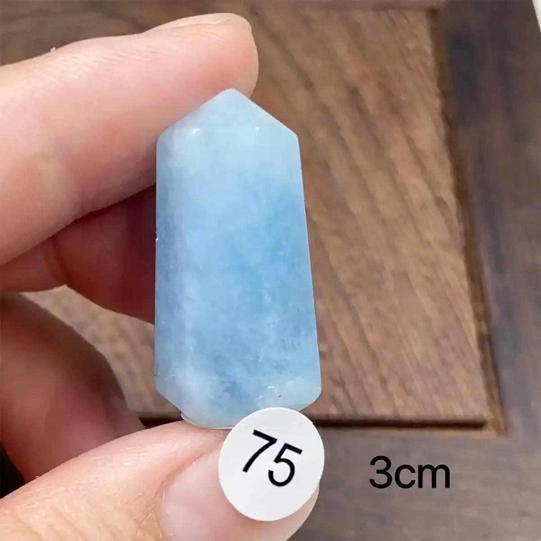 Hand-polished Aquamarine Mini Tower with a faceted point, featuring calming sea-blue hues for Throat Chakra healing.