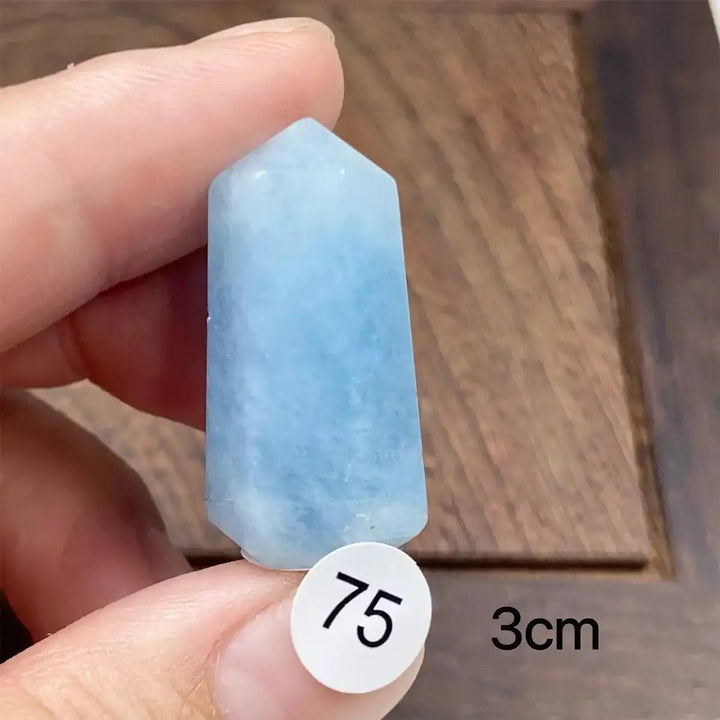 Hand-polished Aquamarine Mini Tower with a faceted point, featuring calming sea-blue hues for Throat Chakra healing.