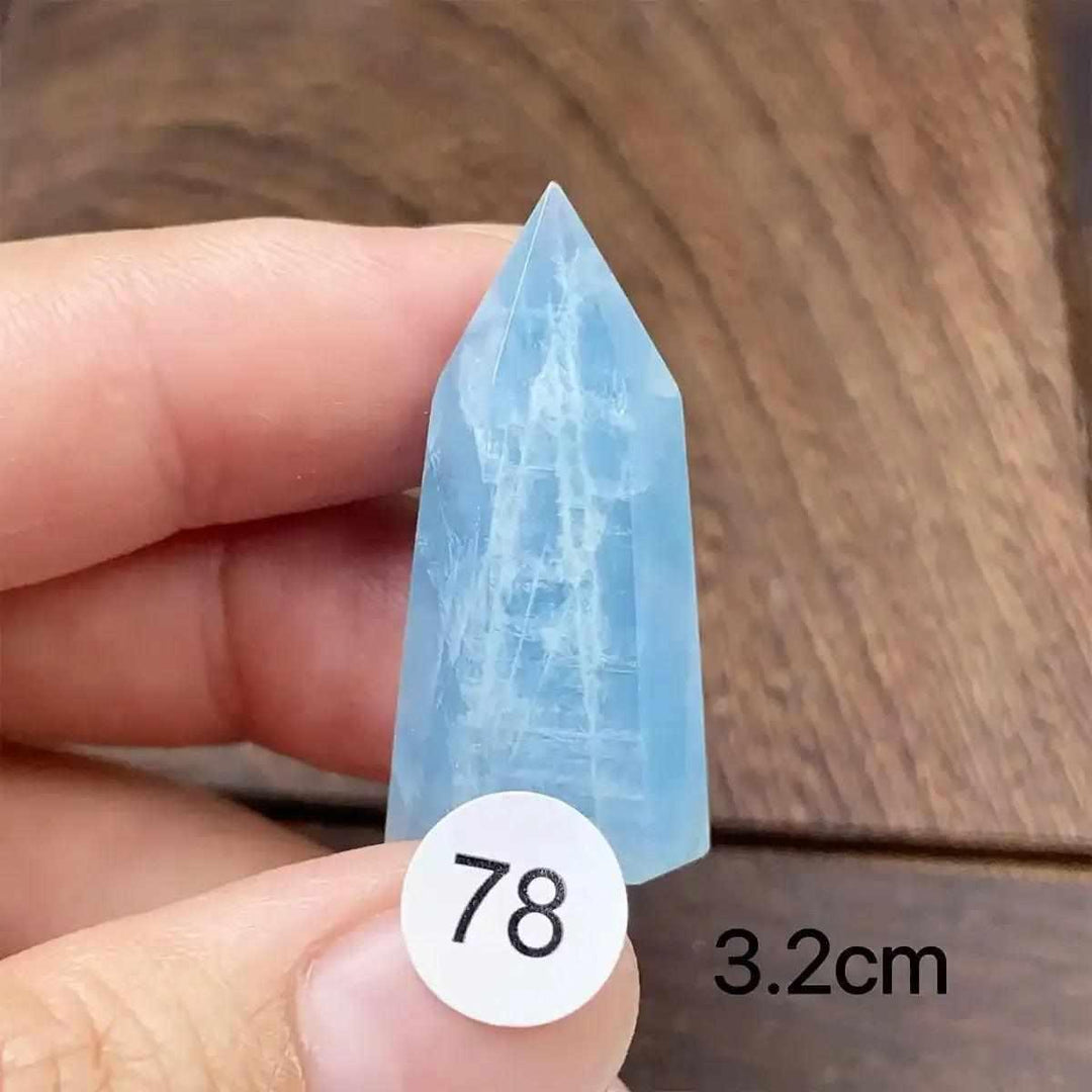 Hand-polished Aquamarine Mini Tower, piece 78, featuring a sea-blue faceted point for calm, clear communication.
