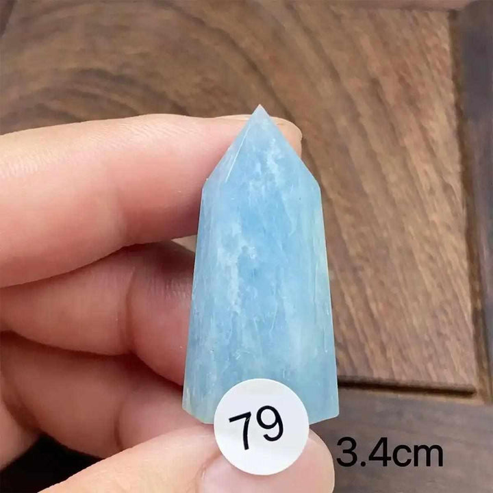 Hand-polished Aquamarine Mini Tower, number 79, featuring a sea-blue faceted point for calming energy and communication.
