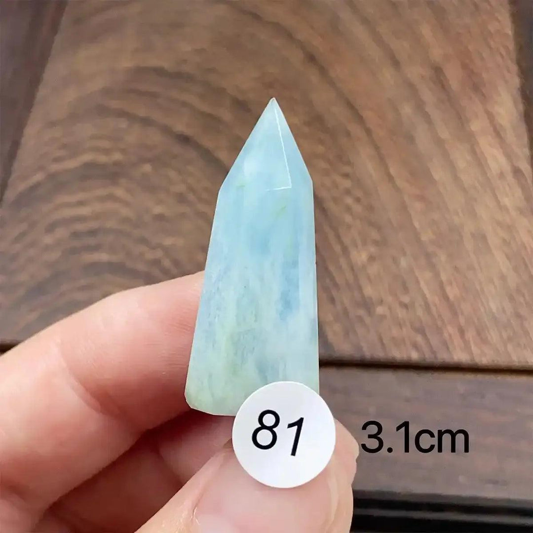 Hand-polished Aquamarine Mini Tower with a faceted point, featuring calming sea-blue tones for throat chakra healing.
