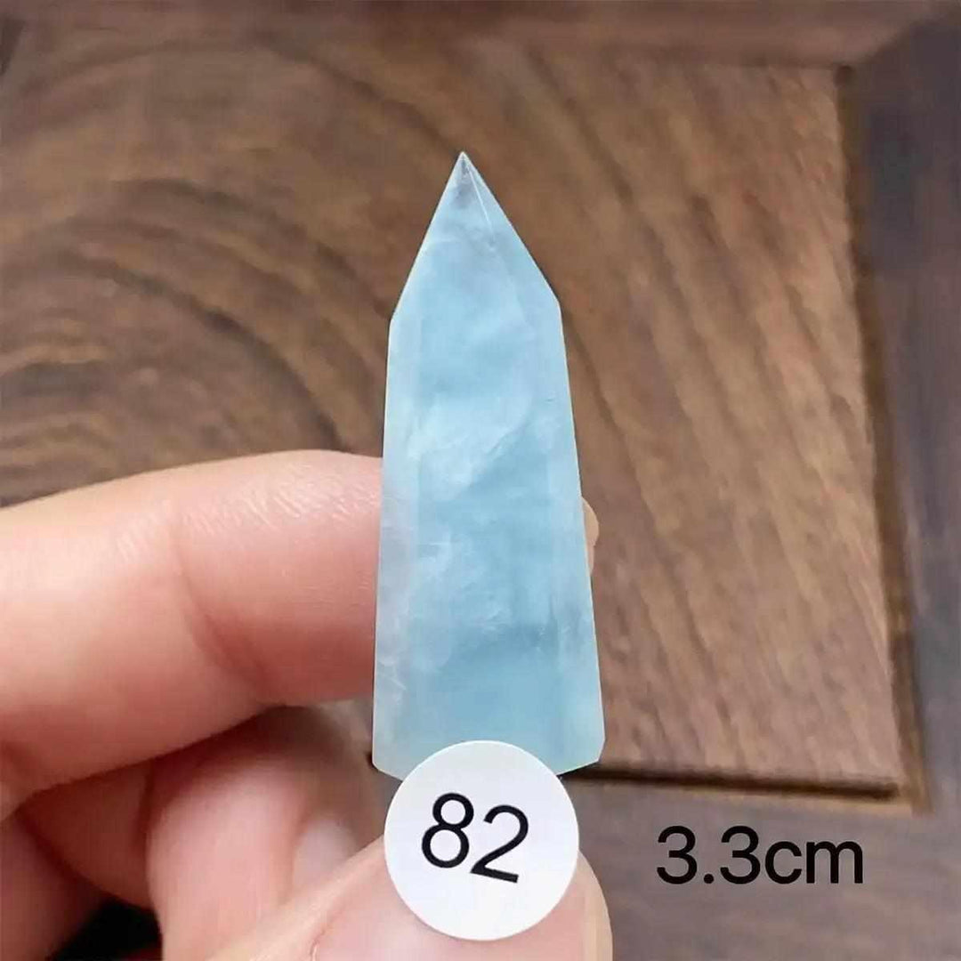 Hand-polished Aquamarine Mini Tower, piece 82, featuring a sea-blue faceted point for calm, clear communication.