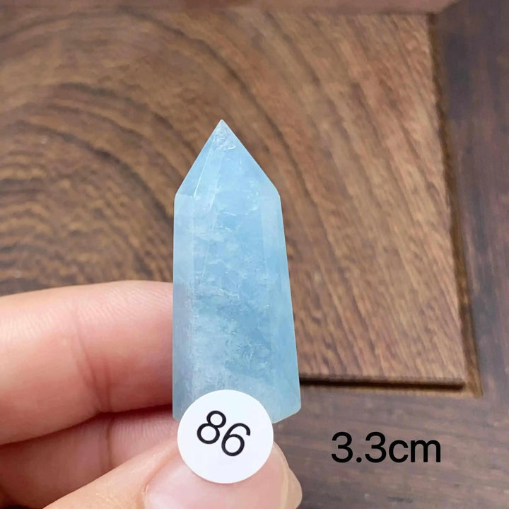 Hand-polished Aquamarine Mini Tower with a faceted point, featuring calming sea-blue tones for meditation and healing.