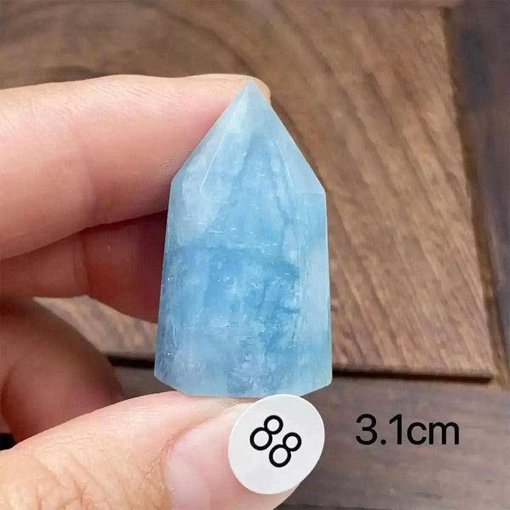 Small Aquamarine Mini Tower with a faceted point, featuring sea-blue hues for calm communication and heart healing.
