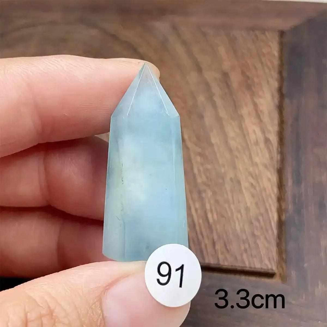 Hand-polished Aquamarine Mini Tower, piece 91, featuring a serene sea-blue faceted point for calm, clear communication.