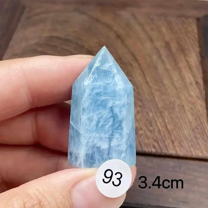 Hand-polished Aquamarine Mini Tower with a faceted point, featuring calming sea-blue tones for Throat Chakra healing.
