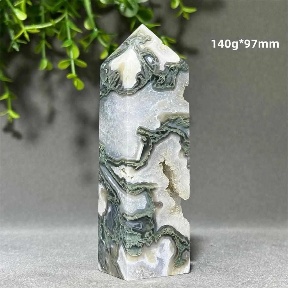 Polished aquatic agate crystal cave tower with flowing green patterns and a sparkling quartz sanctuary for chakra healing.