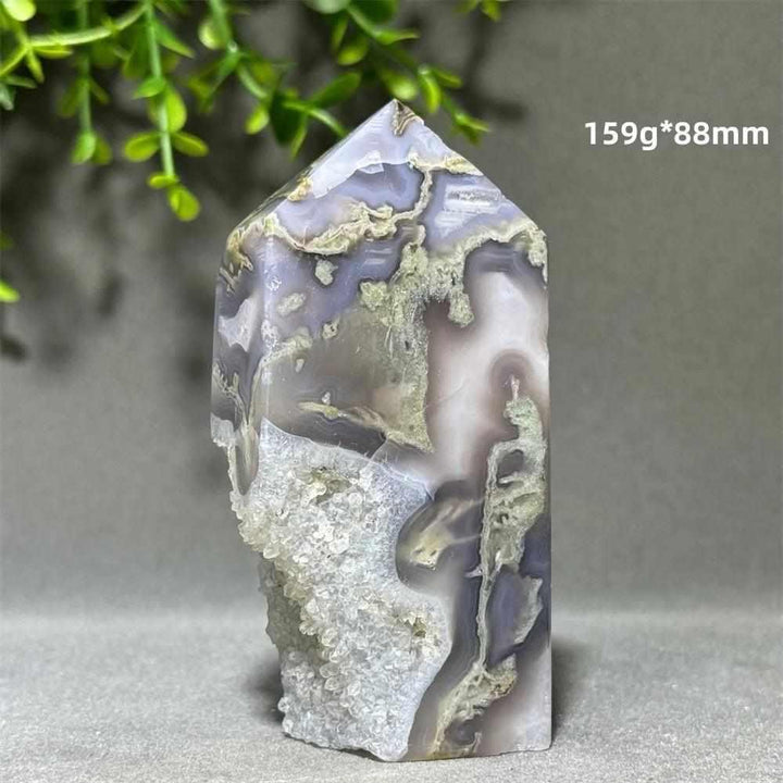 Polished Aquatic Agate Crystal Cave Tower with sparkling quartz pocket and flowing patterns for Throat Chakra healing.
