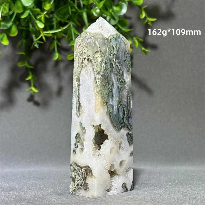 Aquatic Agate Crystal Cave Tower with green water-like patterns and a sparkling quartz pocket for Throat Chakra healing.