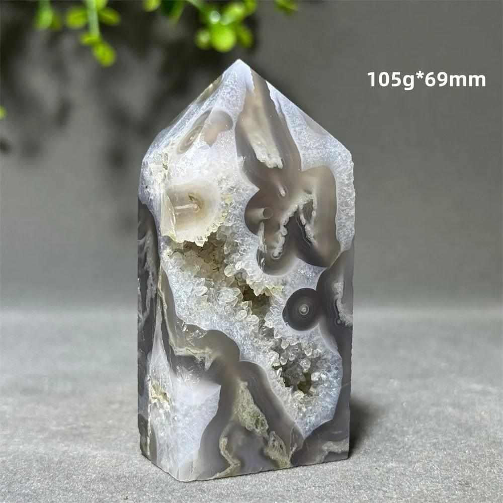 Polished Aquatic Agate Crystal Cave Tower featuring sparkling quartz pockets and calming, water-like grey patterns.