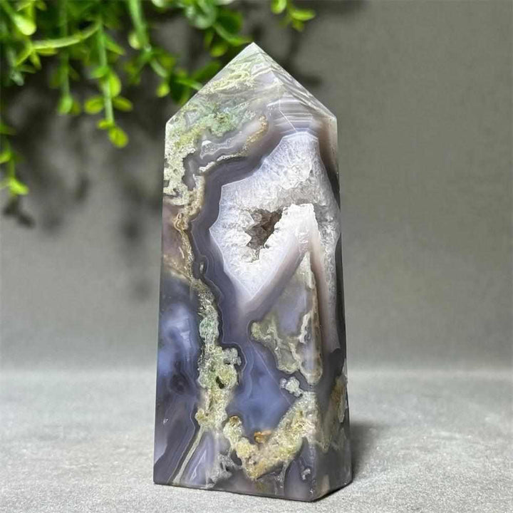 Polished Aquatic Agate crystal tower with a sparkling quartz cave, featuring calming water patterns for chakra healing.