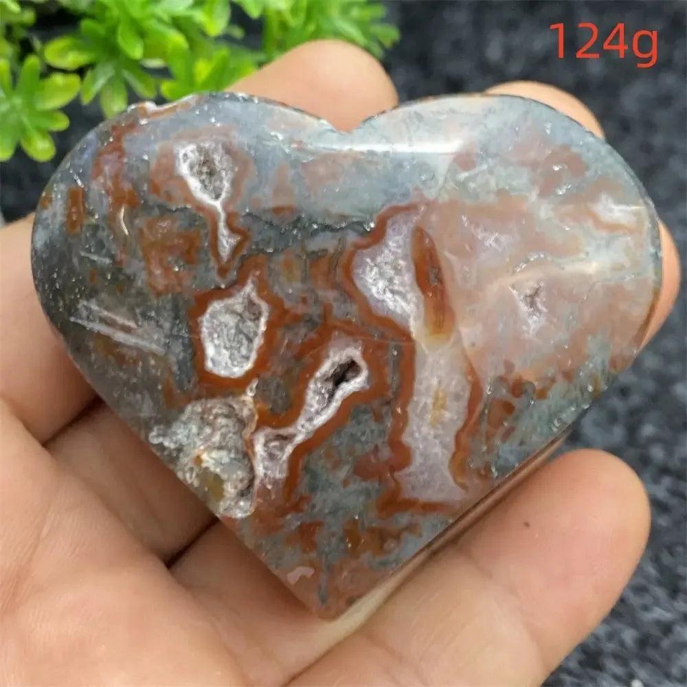 Aquatic Agate Geode Heart: Polished, natural crystal heart with red, gray, and white patterns, featuring sparkling druzy cavities.