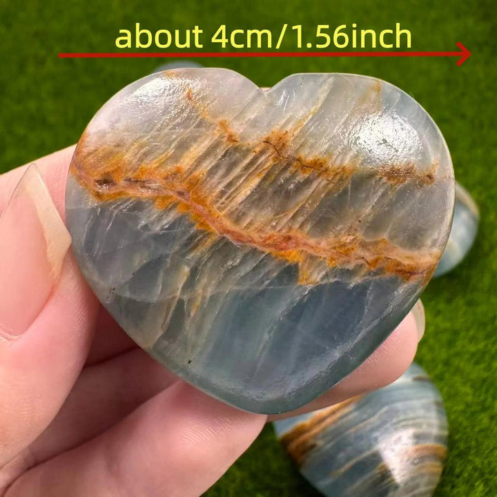 4cm Aquatine Lemurian Blue Calcite crystal heart with soothing blue and orange bands.