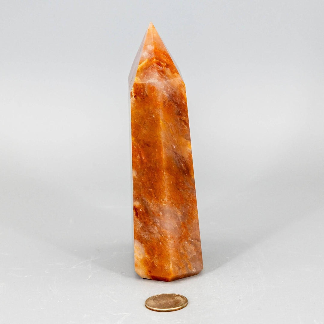 Rare Aragonite XL Tower, a thick, polished crystal in warm cream, tan, and brown tones.