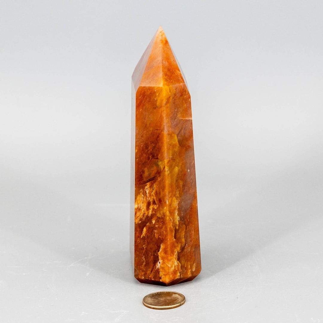 Rare Aragonite XL Tower, a thick, polished crystal in warm cream, tan, and brown earthy tones.