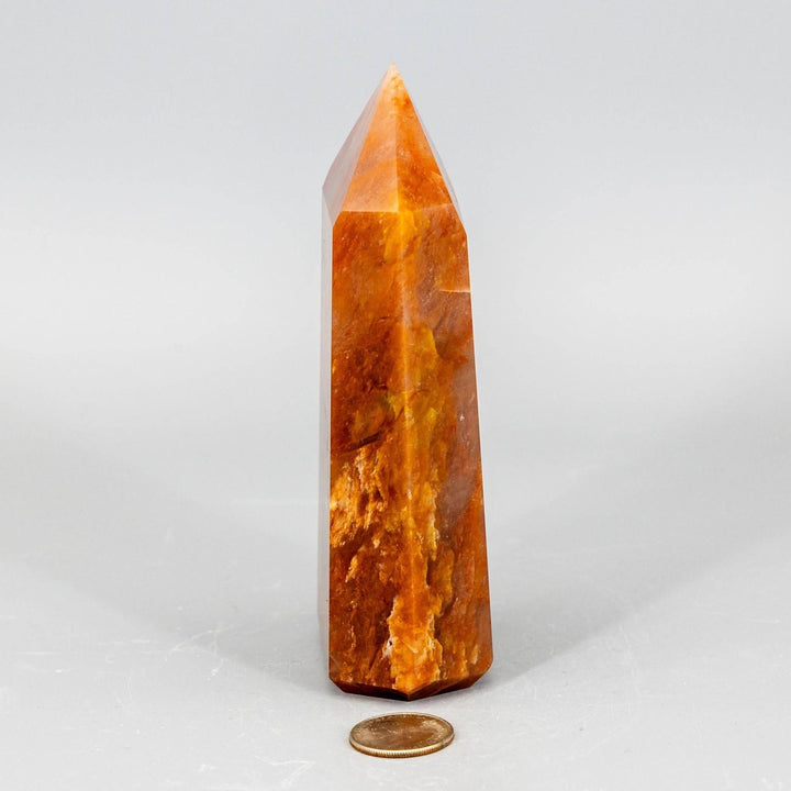 Rare Aragonite XL Tower, a thick, polished crystal in warm cream, tan, and brown earthy tones.