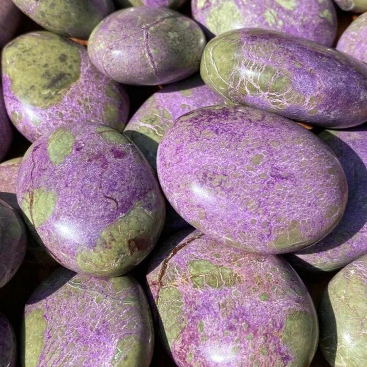 Polished Bohemian Atlantis Crystal palm stones in marbled green and purple stichtite.