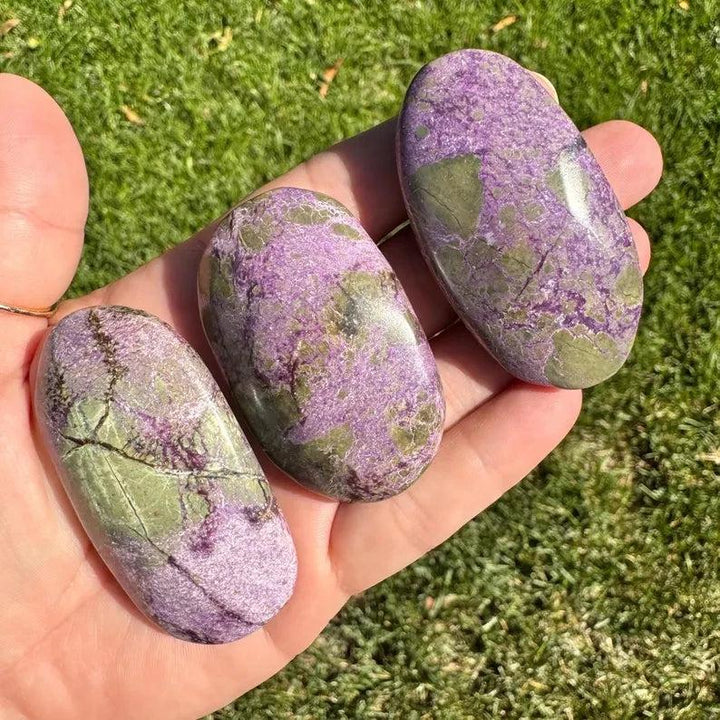 Bohemian Atlantis Crystal Palm Stones with marbled green and purple patterns for healing.