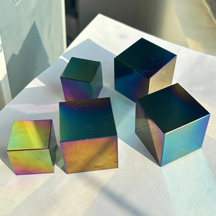 Iridescent Aura Black Obsidian polished geometric cubes with a glossy, rainbow-colored metallic sheen.