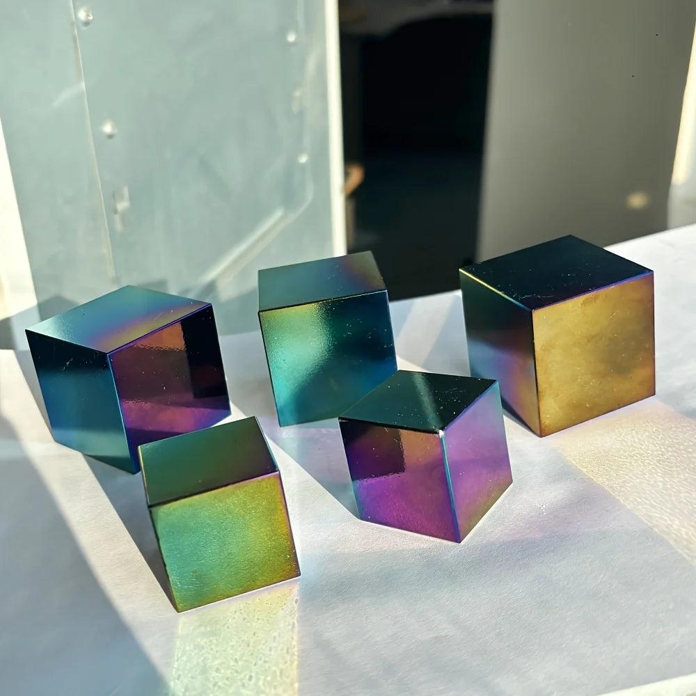 Polished Aura Black Obsidian cubes with a vibrant, iridescent rainbow sheen for healing and modern decor.