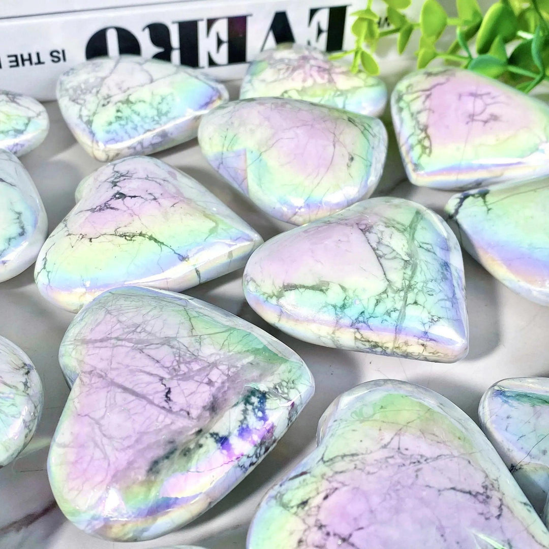 Iridescent Aura Howlite crystal hearts by Crystal Destiny, featuring calming white with rainbow flashes.