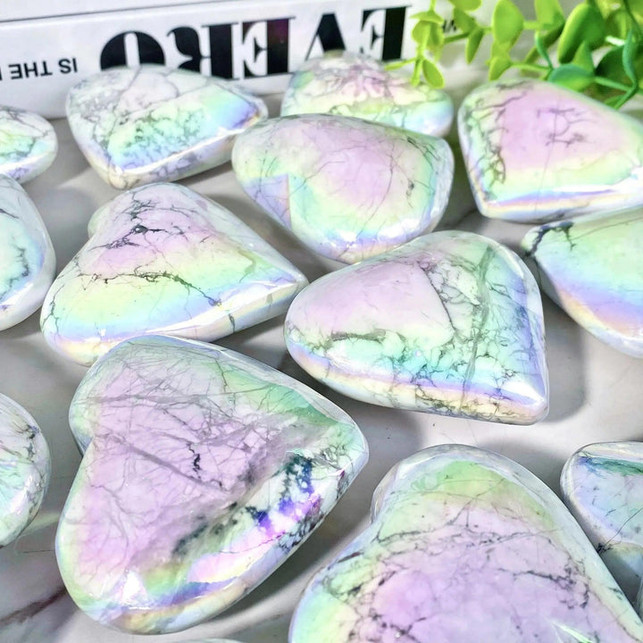 Iridescent Aura Howlite crystal hearts by Crystal Destiny, featuring calming white with rainbow flashes.