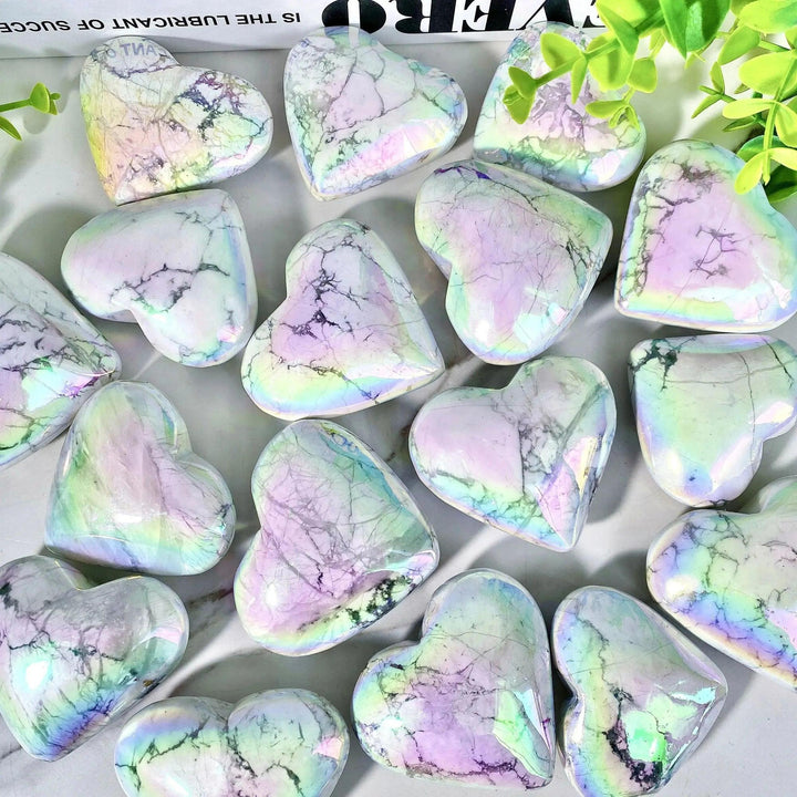 Iridescent Aura Howlite crystal hearts by Crystal Destiny, radiating calming white with rainbow flashes.