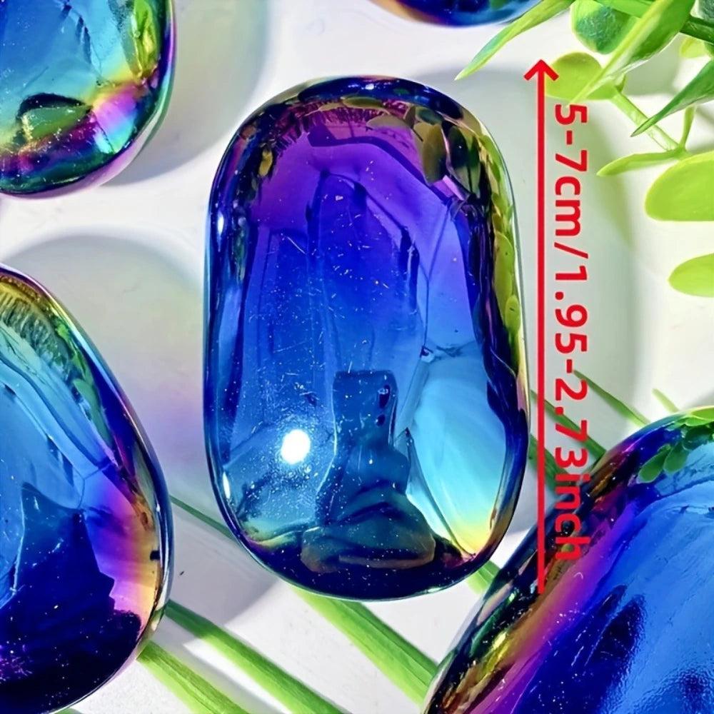 Polished Aura Obsidian palm stone with iridescent blue and violet shimmer for grounding and root chakra healing.