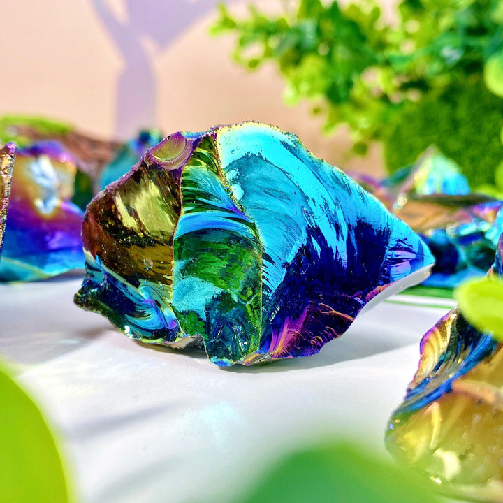 Aura Obsidian Raw Crystal Stone for Grounding Protection, showcasing iridescent gold, violet, and teal hues.