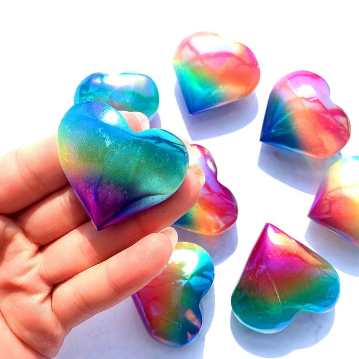 Handheld Aura Selenite crystal heart with a shimmering, iridescent rainbow metallic finish for cleansing and love.