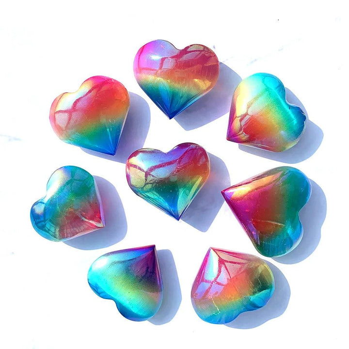 Polished Aura Selenite crystal hearts with an iridescent rainbow sheen, perfect for cleansing and healing meditation.