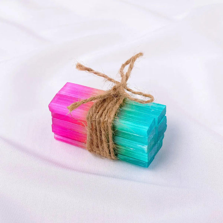 Aura Selenite Crystal Sticks tied with twine, featuring a vibrant iridescent rainbow sheen for cleansing and healing.