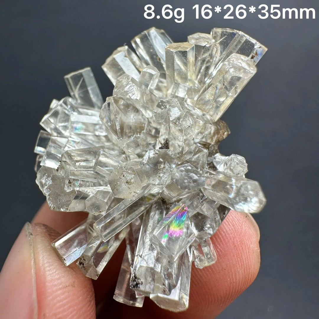 Clear aurora columnar calcite cluster flower raw healing crystal with rainbow flash.