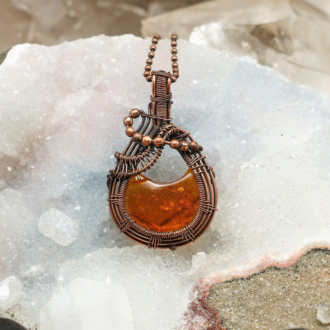 Handcrafted 2.25" Baltic Amber Wire Wrap Pendant with warm golden honey tones in healing copper.