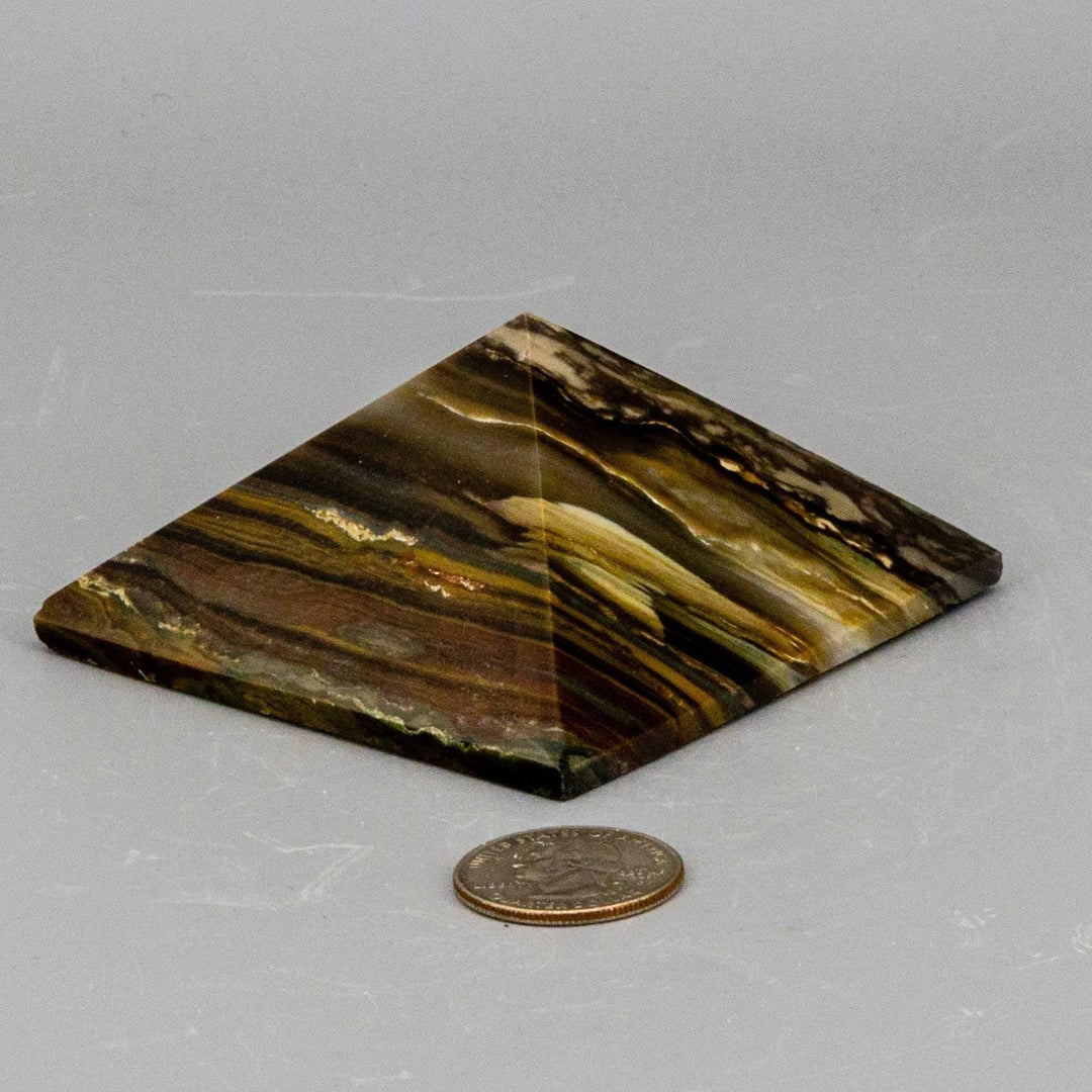 Polished Banded Agate Crystal Pyramid, 76mm, with earthy concentric layers for grounding and altar work.