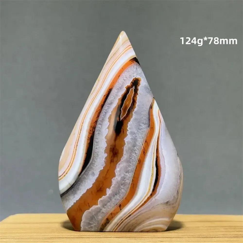Banded Agate freeform torch from Crystal Destiny, featuring warm orange, white, and grey layers.
