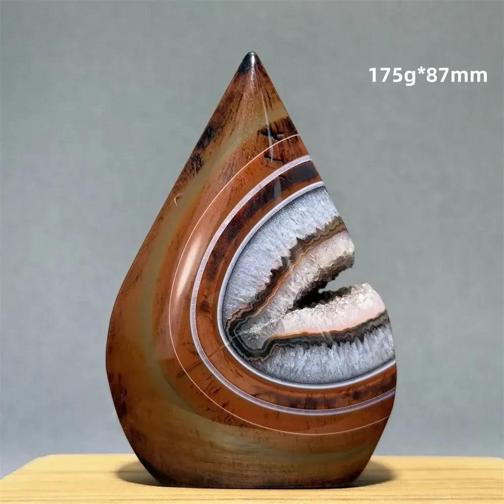 Banded Agate freeform torch from Crystal Destiny, featuring warm browns, creams, and a geode-like opening.