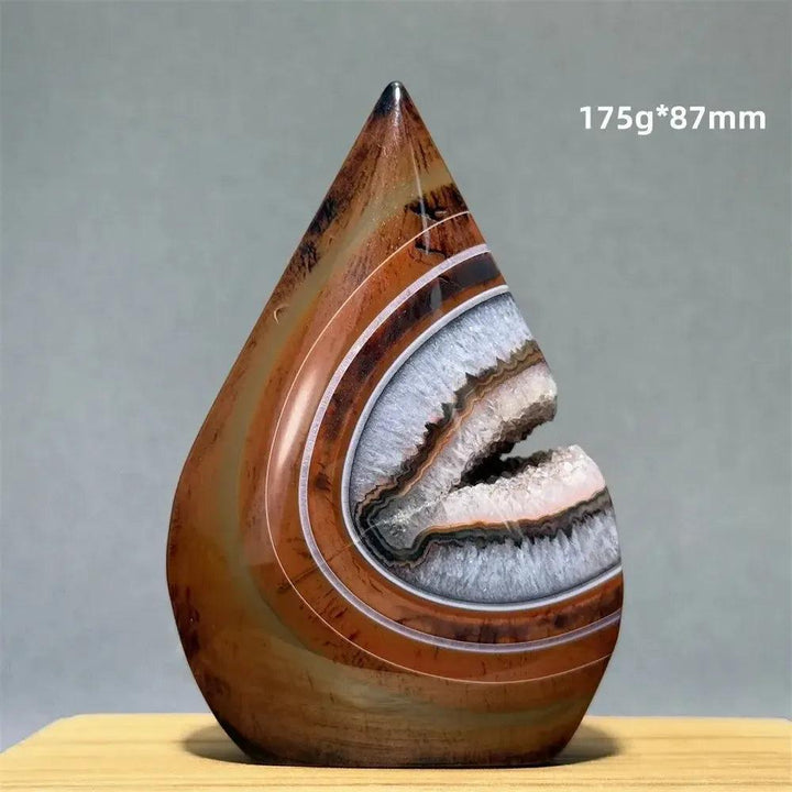 Banded Agate freeform torch from Crystal Destiny, featuring warm browns, creams, and a geode-like opening.