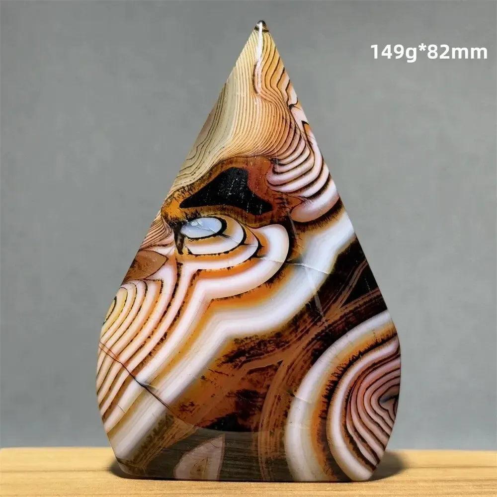 Crystal Destiny's Banded Agate freeform torch, with warm creams, tans, and browns, offers grounding energy.