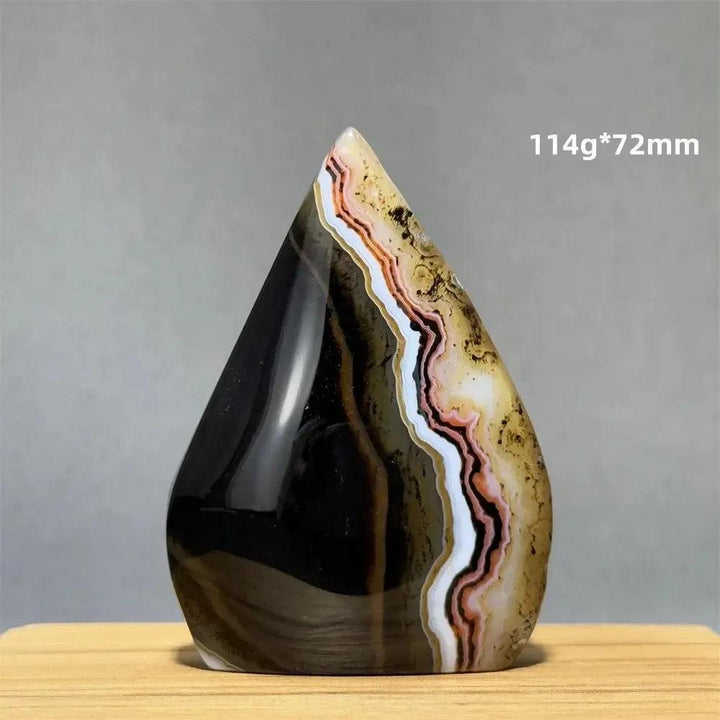 Banded Agate freeform torch from Crystal Destiny, featuring earthy browns, black, white, and pink stripes.