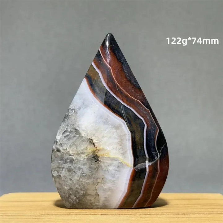 Natural Banded Agate freeform torch from Crystal Destiny, featuring earthy browns, white, and black stripes.