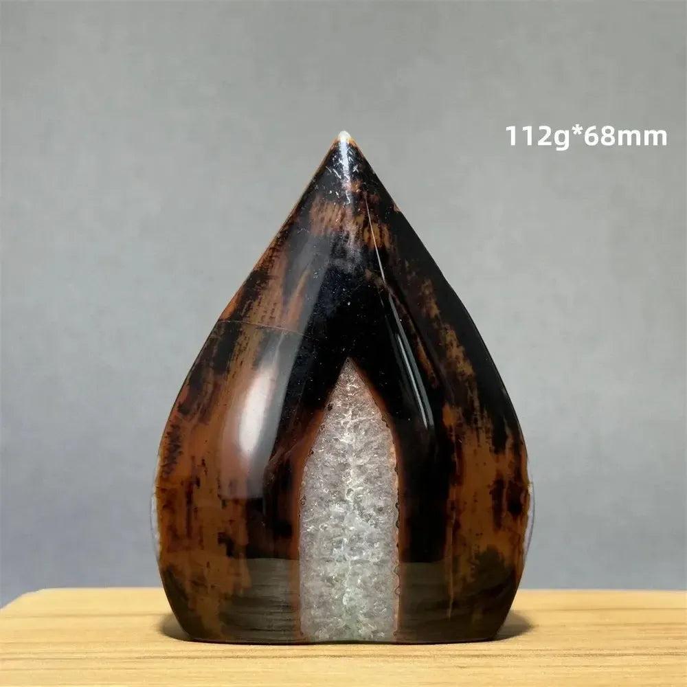 Banded Agate freeform torch from Crystal Destiny, featuring dark brown, black, and white concentric stripes.