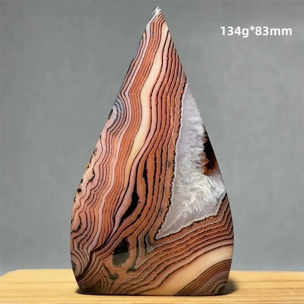 Banded Agate freeform torch from Crystal Destiny, featuring warm creams, tans, and browns with a white geode inclusion.
