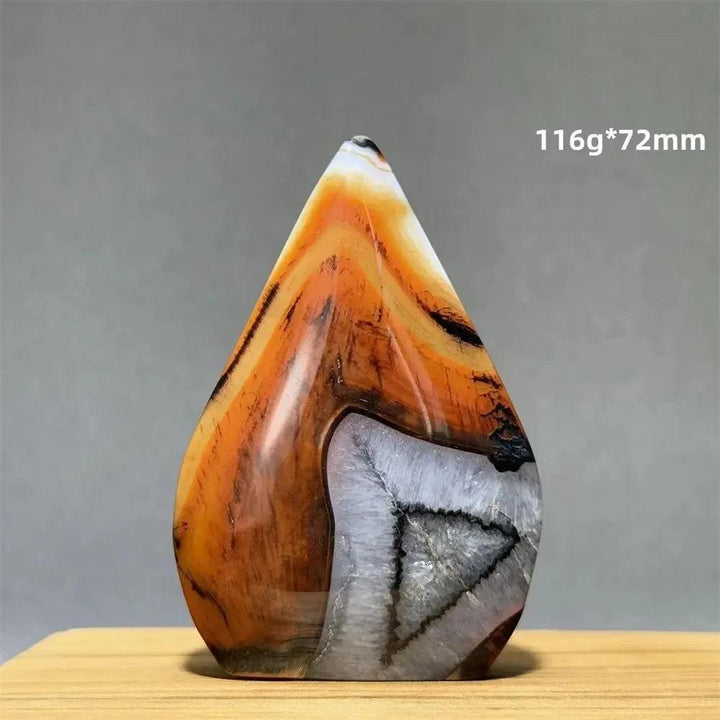Banded Agate freeform torch from Crystal Destiny, featuring warm orange, brown, and white layers for grounding.