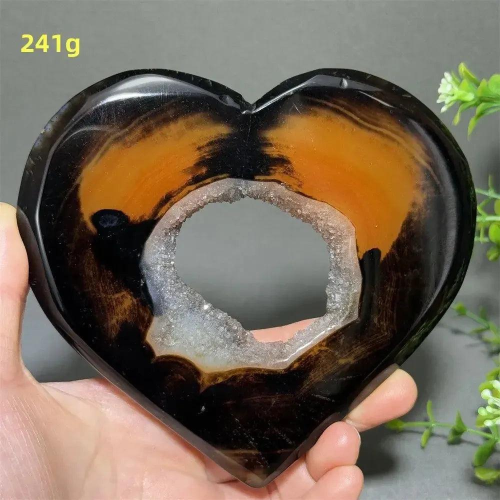 Banded Agate Geode Crystal Heart for Grounding & Stability, with bold red, black, brown, and white layers.