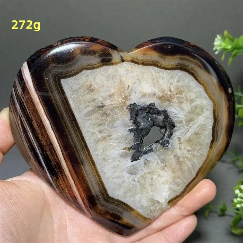 Banded Agate Geode Crystal Heart for Grounding & Stability, with red, black, brown, and white concentric layers.