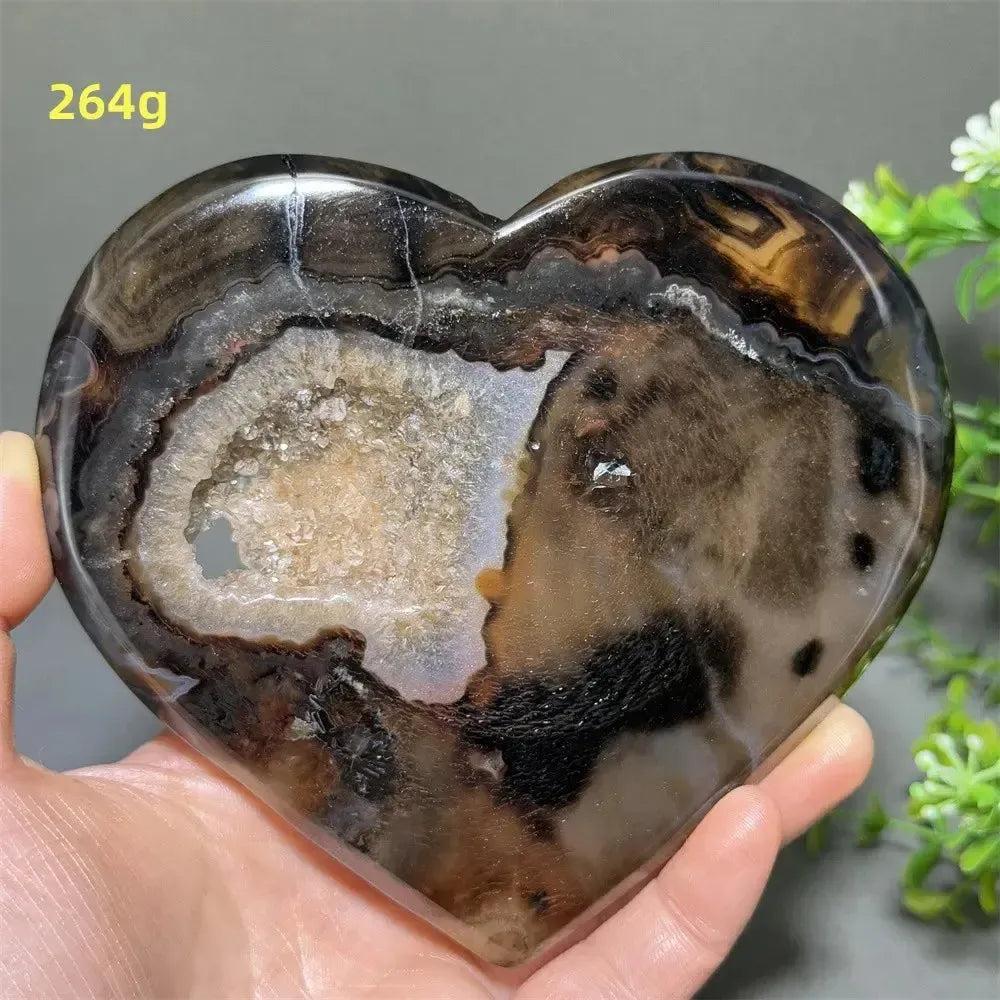 Banded Agate Geode Crystal Heart for Grounding & Stability, with bold red, black, brown, and white concentric layers.